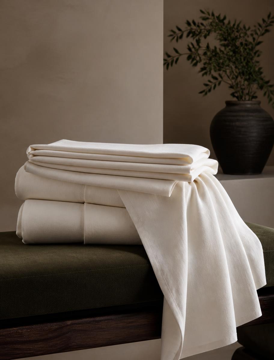 Folded ivory bedsheets